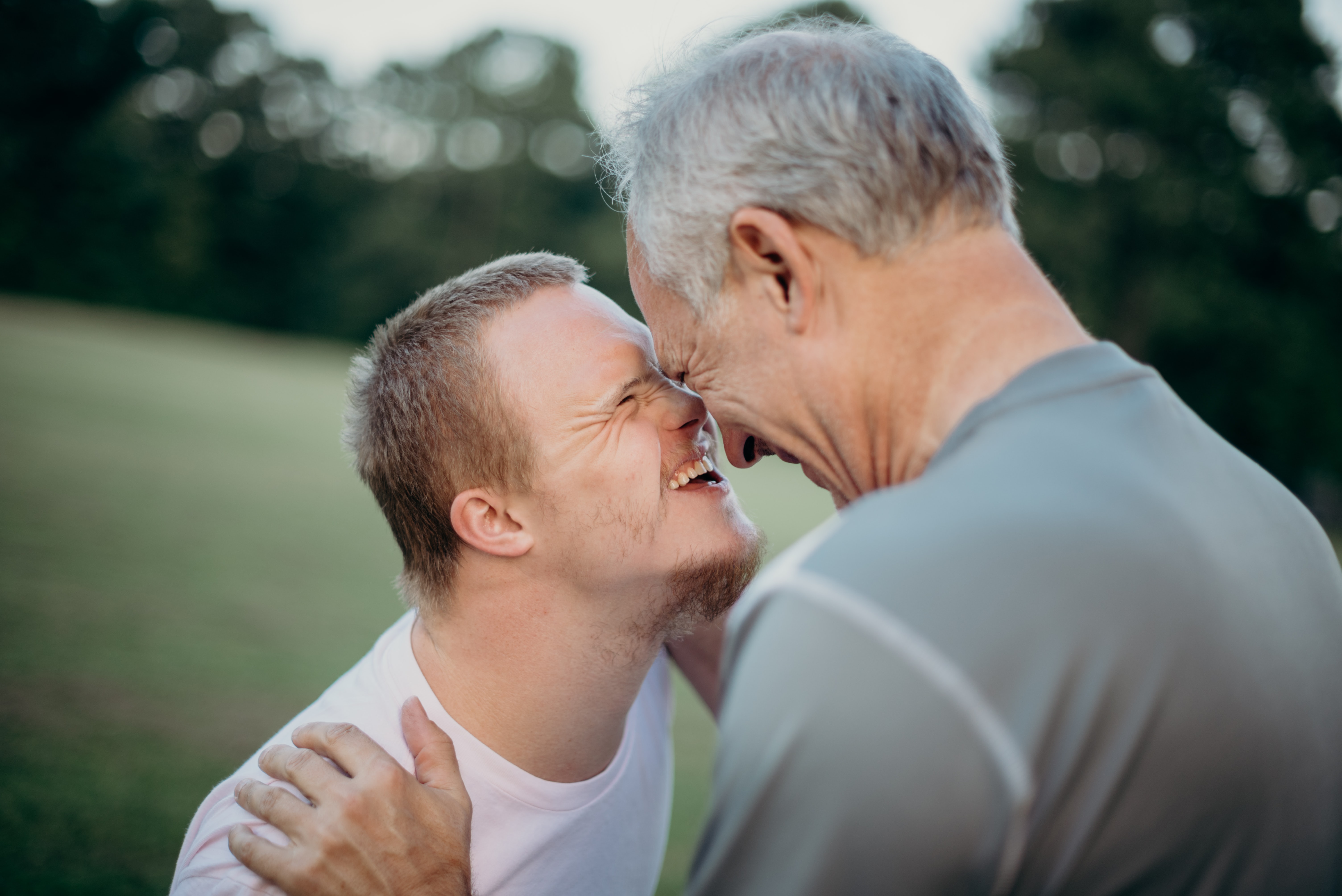 Two men laughing.